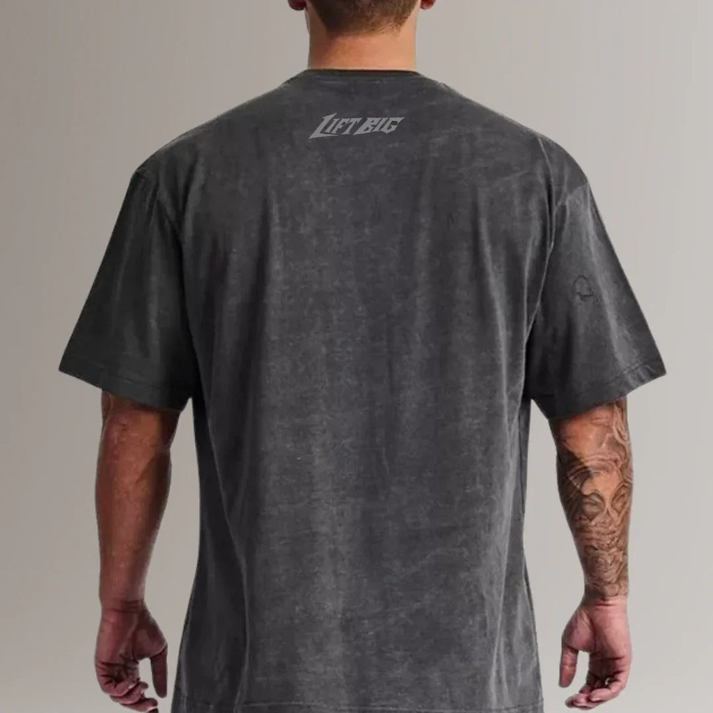 Man wearing black Lift Big fitness t-shirt, back view, fitness apparel, tattooed arm