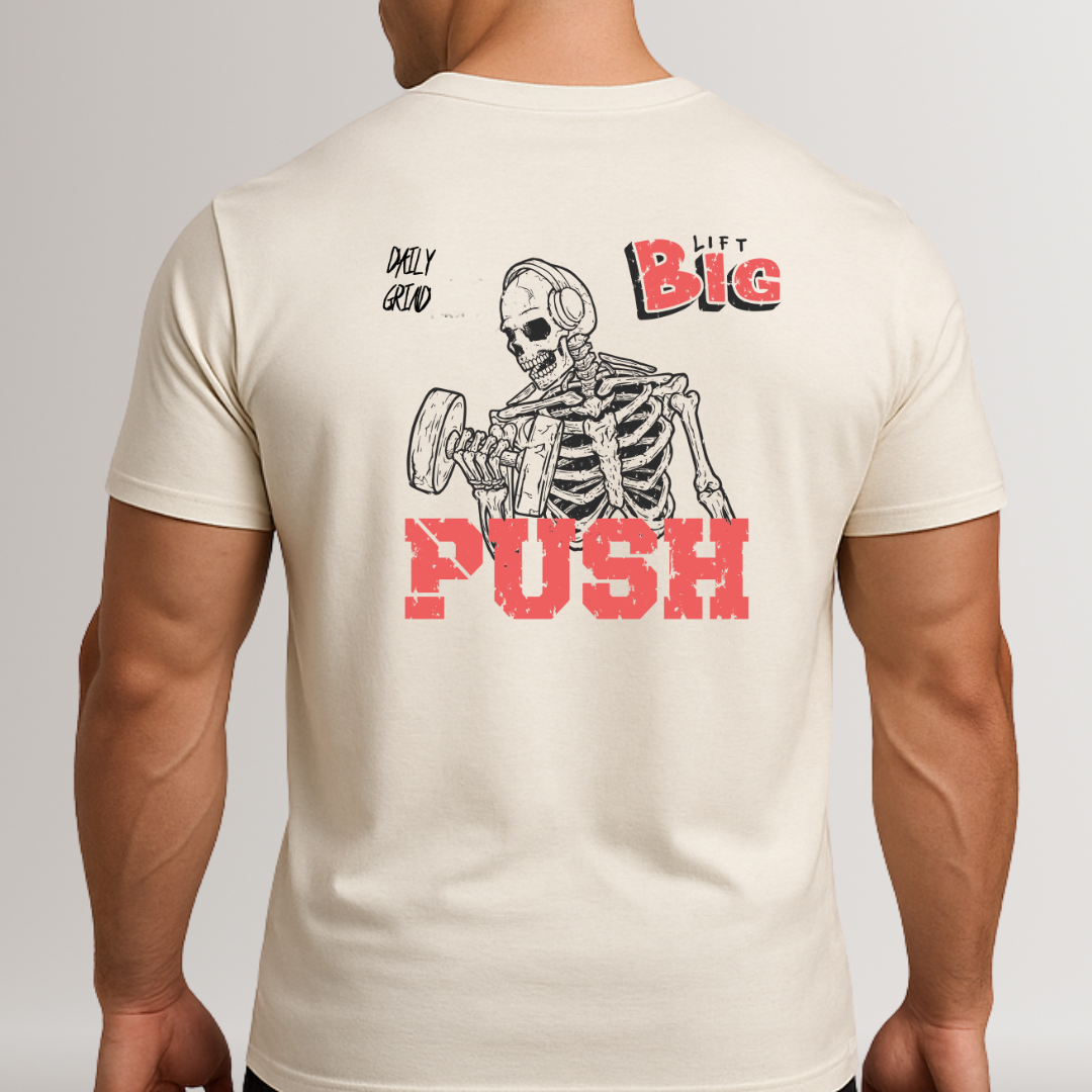 Beige t-shirt with a skeleton graphic and text on the back, worn by a person.