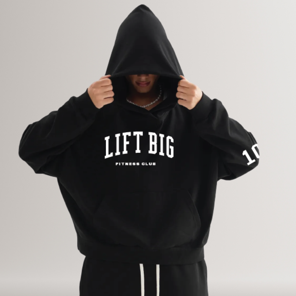 Person wearing a black hoodie with 'LIFT BIG' text on a gray background