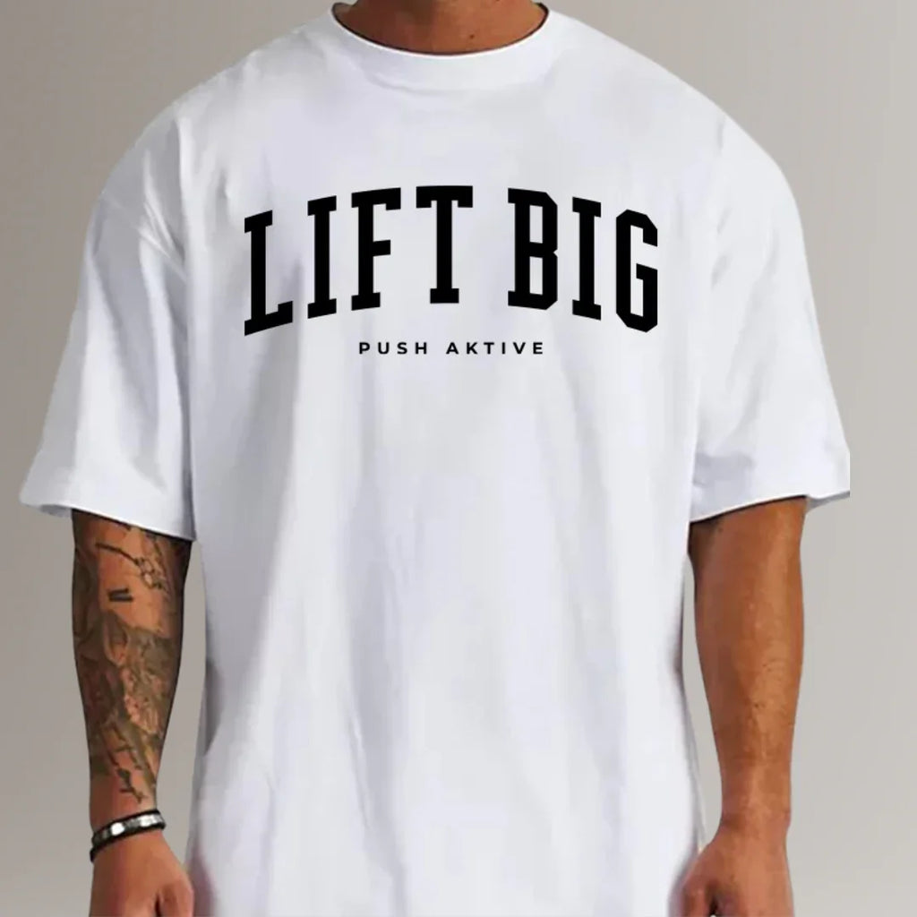 White oversized gym t-shirt with bold 'LIFT BIG' and 'PUSH AKTIVE' text, fitness apparel