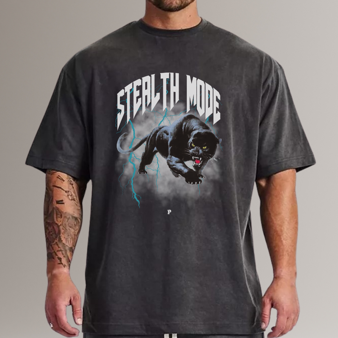 Person wearing a black t-shirt with a panther graphic and 'Stealth Mode' text on a gray background