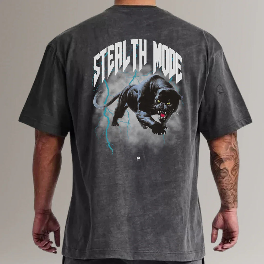 Man wearing black acid wash fitness t-shirt with roaring panther and 'Stealth Mode' graphic