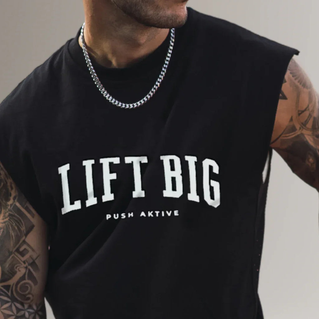 Man wearing black sleeveless fitness shirt with 'LIFT BIG' text, gym apparel