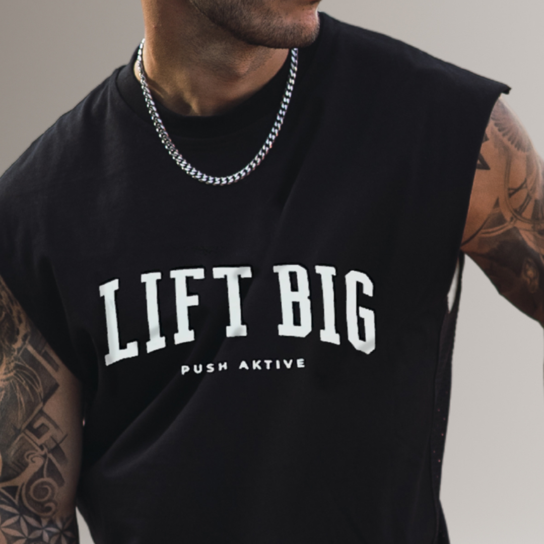 Black sleeveless shirt with 'LIFT BIG' text worn by a person.