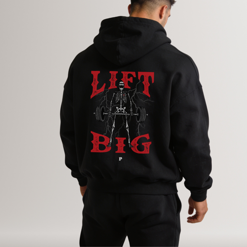 Black hoodie with 'Lift Big' graphic on the back worn by a person, on a plain background