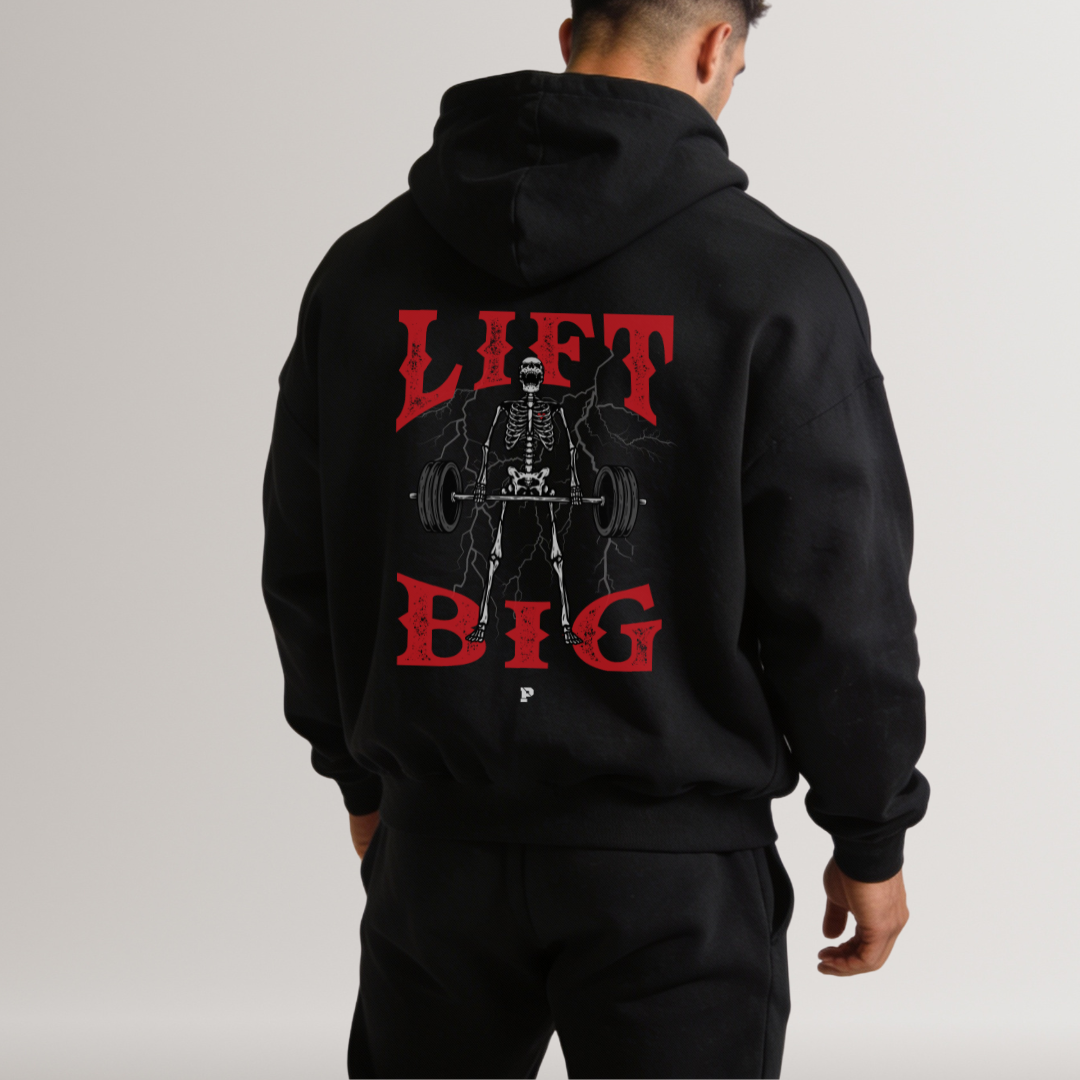 Black hoodie with 'Lift Big' graphic on the back worn by a person, on a plain background
