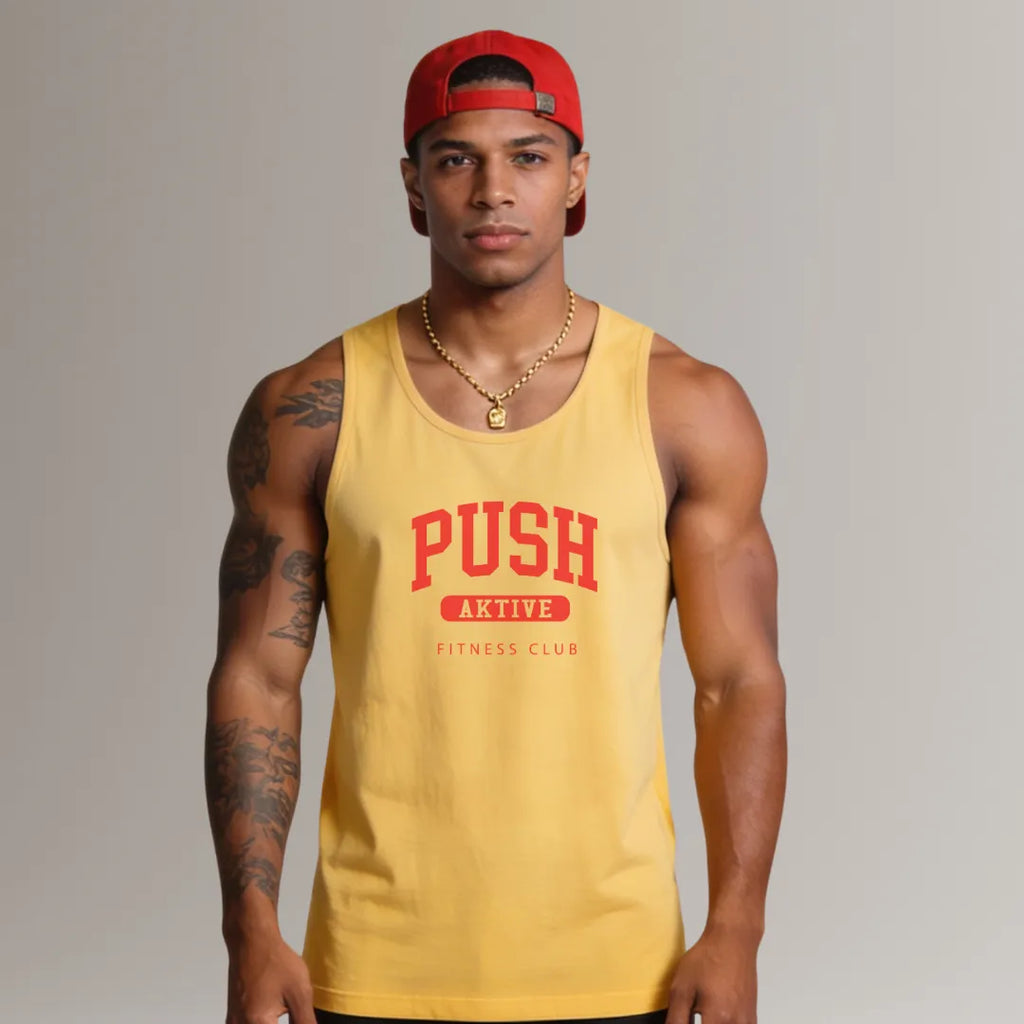Man wearing a yellow tank top with 'PUSH Aktive Fitness Club' text and a red cap on a gray background