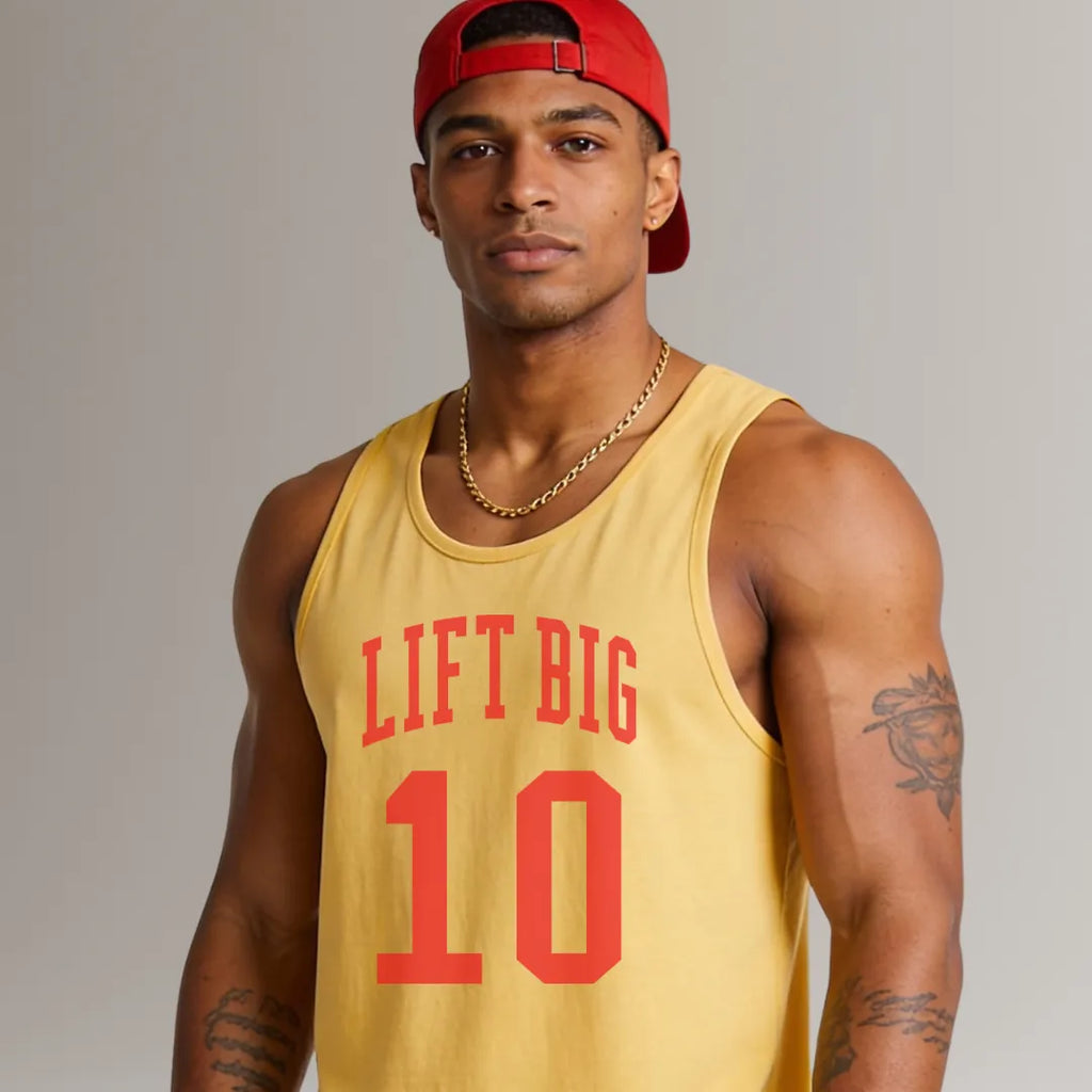 Man wearing a yellow tank top with 'LIFT BIG 10' text and a red cap on a gray background