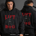 Black hoodie with 'Lift Big' graphic and skeleton lifting weights on front and back, worn by a person.