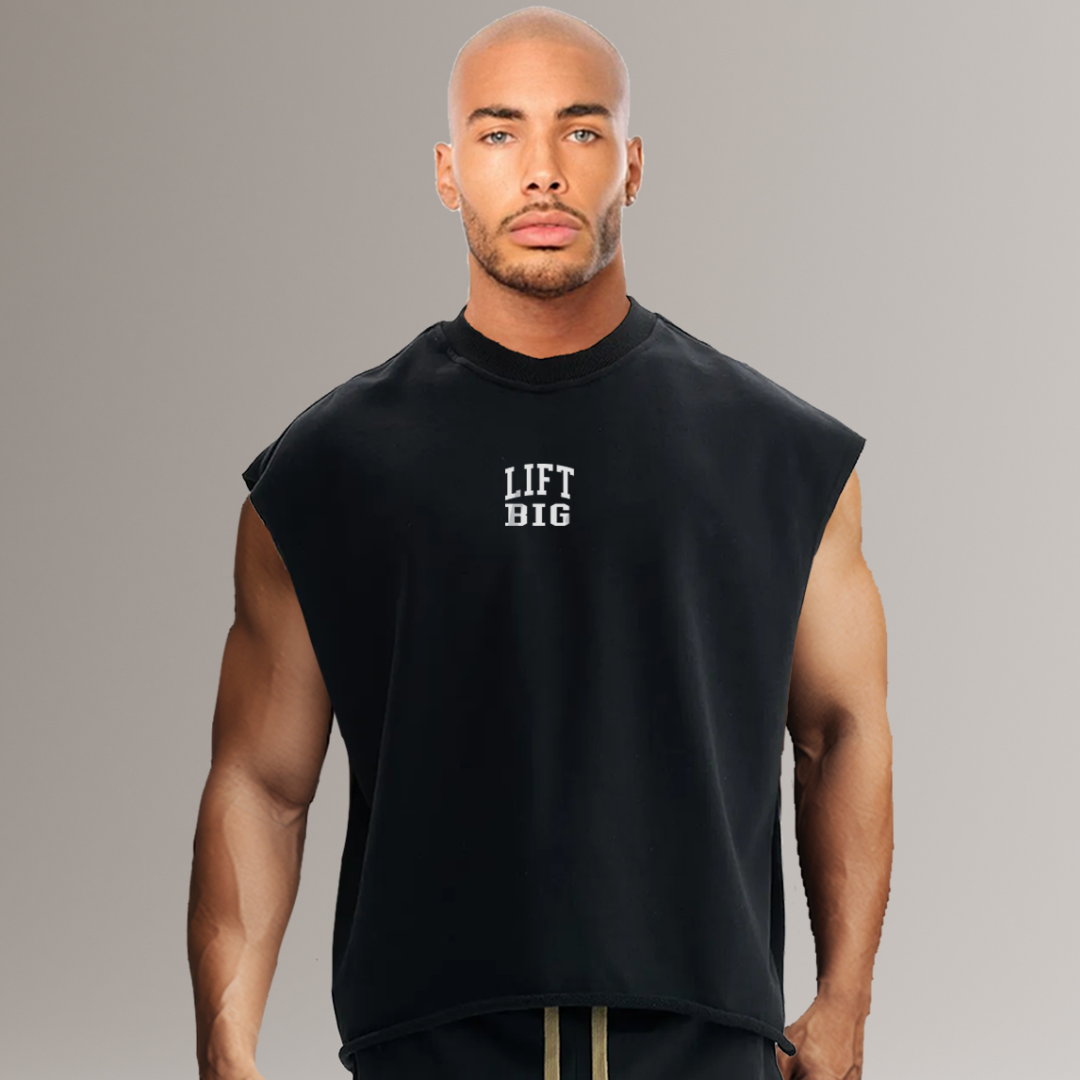 Man wearing a black sleeveless shirt with 'LIFT BIG' text on a gray background